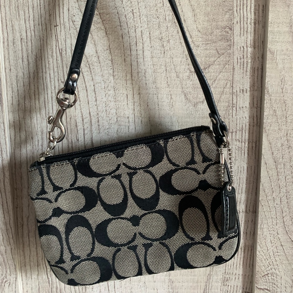 Coach canvas wristlet signature C size: 6.25" x4.25"
